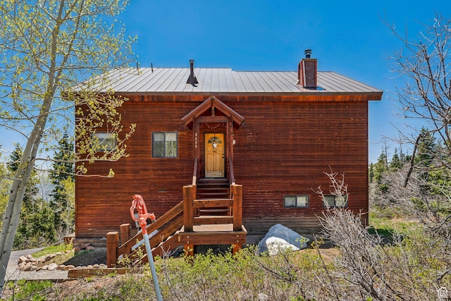 2620 Crow Loop, Coalville, UT 84017 - view of front of home featuring a chimney, a standing seam roof, and metal roof