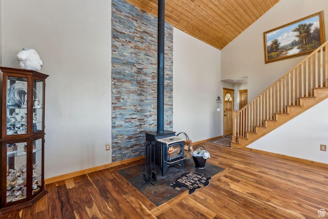 2620 Crow Loop, Coalville, UT 84017 - living room with a wood stove, wood-type flooring, baseboards, stairs, and wooden ceiling