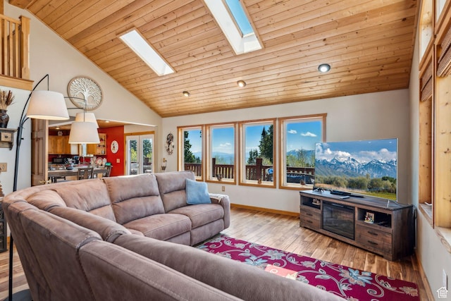 2620 Crow Loop, Coalville, UT 84017 - living room featuring a skylight, hardwood / wood-style flooring, lofted ceiling, wood ceiling, and baseboards