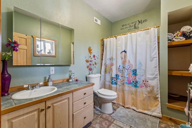 2620 Crow Loop, Coalville, UT 84017 - bathroom featuring toilet, vanity, a shower with shower curtain, and a textured ceiling