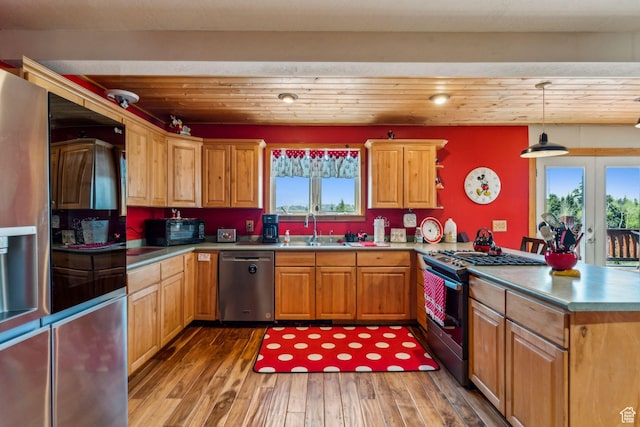2620 Crow Loop, Coalville, UT 84017 - kitchen with appliances with stainless steel finishes, a sink, a peninsula, healthy amount of natural light, and wood ceiling