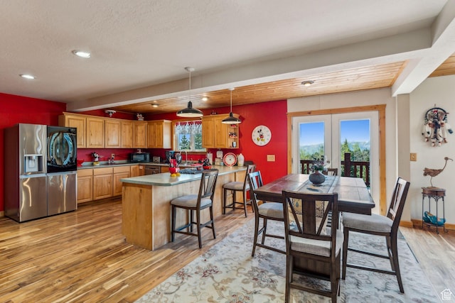 2620 Crow Loop, Coalville, UT 84017 - kitchen with appliances with stainless steel finishes, a peninsula, light wood-style floors, french doors, and recessed lighting