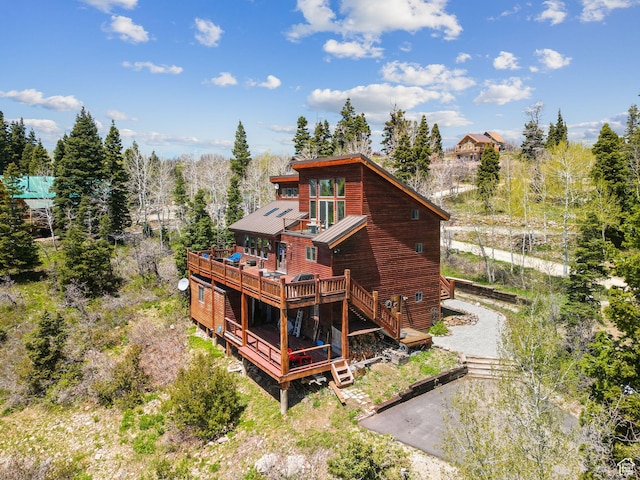 2620 Crow Loop, Coalville, UT 84017 - back of property featuring a wooden deck and stairway