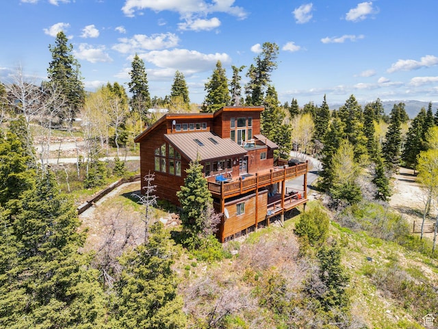 2620 Crow Loop, Coalville, UT 84017 - back of property featuring a standing seam roof, metal roof, and a wooden deck