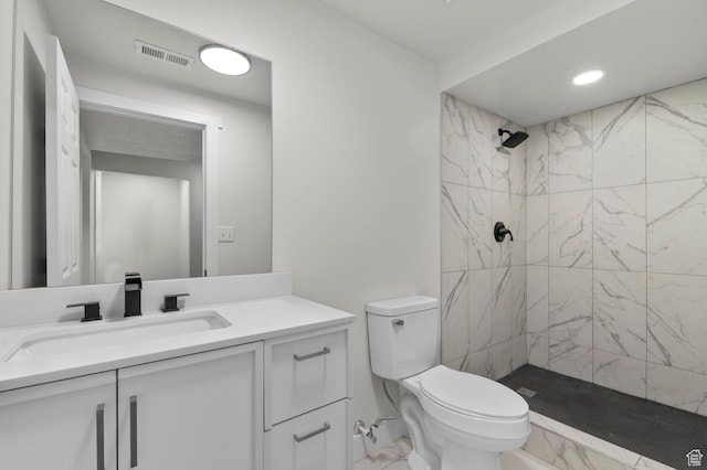 4112 W 5085 S, Kearns, UT 84118 - bathroom with marble look tile flooring, vanity, toilet, tiled shower, and recessed lighting