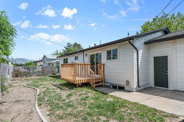 4112 W 5085 S, Kearns, UT 84118 - back of property with a fenced backyard and a wooden deck