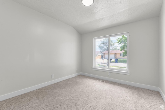 4112 W 5085 S, Kearns, UT 84118 - empty room with light carpet, baseboards, a textured ceiling, and lofted ceiling