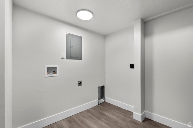 4112 W 5085 S, Kearns, UT 84118 - laundry area with electric panel, hookup for a washing machine, hookup for an electric dryer, wood finished floors, and baseboards