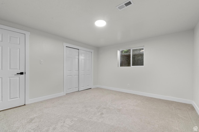 4112 W 5085 S, Kearns, UT 84118 - unfurnished bedroom with baseboards, light colored carpet, and a closet