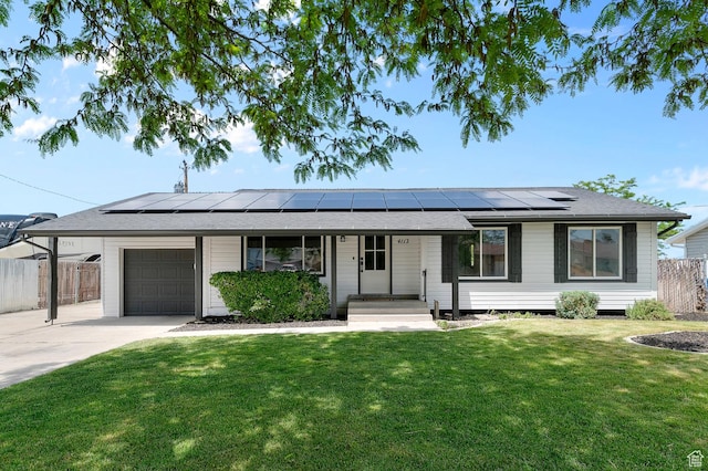 4112 W 5085 S, Kearns, UT 84118 - ranch-style home featuring an attached garage, concrete driveway, and roof mounted solar panels