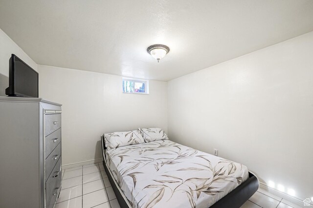 705 N American Beauty Dr, Salt Lake City, UT 84116 - bedroom with light tile patterned flooring and baseboards