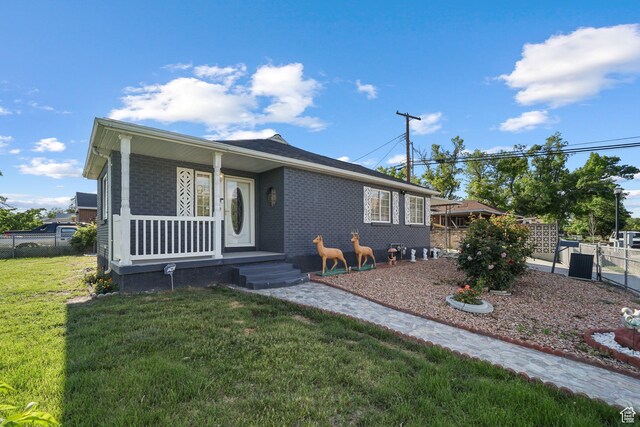 705 N American Beauty Dr, Salt Lake City, UT 84116 - view of front of property with brick siding and a porch