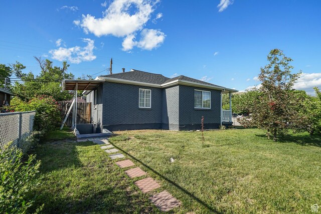 705 N American Beauty Dr, Salt Lake City, UT 84116 - rear view of property featuring brick siding