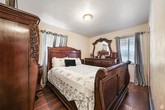 705 N American Beauty Dr, Salt Lake City, UT 84116 - bedroom with dark wood finished floors, baseboards, and a textured ceiling