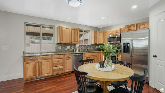 8646 S Spartan Dr, Sandy, UT 84094 - kitchen featuring appliances with stainless steel finishes, a sink, plenty of natural light, backsplash, and recessed lighting