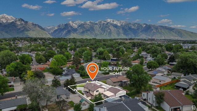 8646 S Spartan Dr, Sandy, UT 84094 - aerial overview of property's location featuring mountains, nearby suburban area, and property parcel outlined