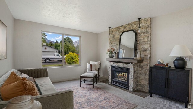 8646 S Spartan Dr, Sandy, UT 84094 - living area featuring carpet, a fireplace, and baseboards