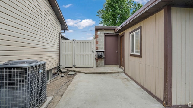 8646 S Spartan Dr, Sandy, UT 84094 - view of patio / terrace featuring cooling unit and a gate