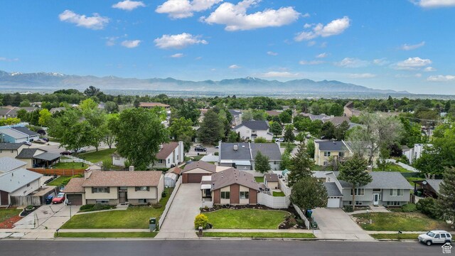 8646 S Spartan Dr, Sandy, UT 84094 - aerial perspective of suburban area featuring a mountain backdrop