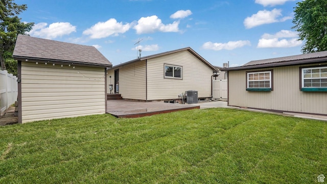 8646 S Spartan Dr, Sandy, UT 84094 - rear view of property featuring an outdoor structure, central air condition unit, a wooden deck, and roof with shingles