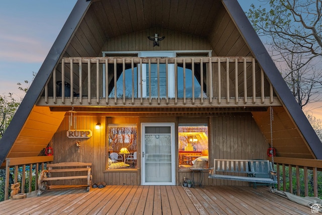 2422 S Valley View Cir, Coalville, UT 84017 - back of house at dusk featuring a balcony