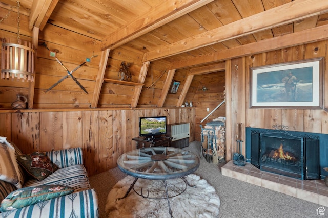 2422 S Valley View Cir, Coalville, UT 84017 - living area with wood walls, wood ceiling with exposed beams, carpet, and a tiled fireplace