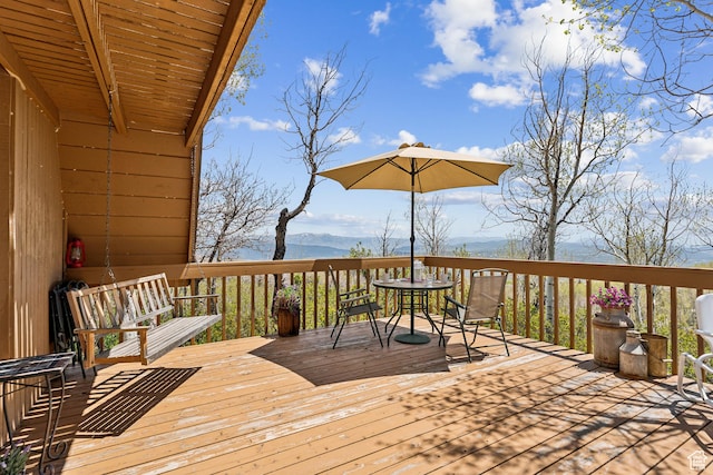 2422 S Valley View Cir, Coalville, UT 84017 - wooden deck featuring a mountain view and outdoor dining space