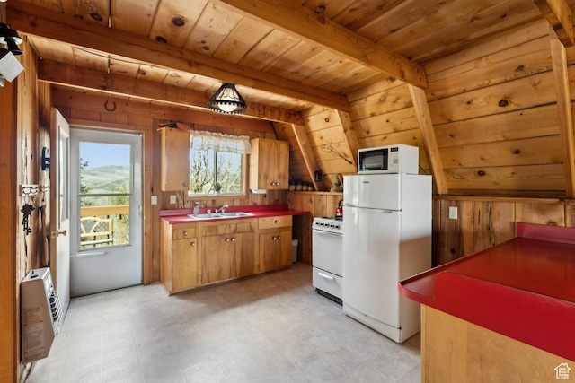 2422 S Valley View Cir, Coalville, UT 84017 - kitchen featuring white appliances, wood walls, heating unit, wooden ceiling with exposed beams, and a sink