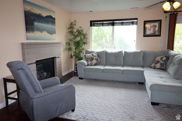 5208 W Case Rd, West Jordan, UT 84081 - living room featuring baseboards, a high end fireplace, and a ceiling fan