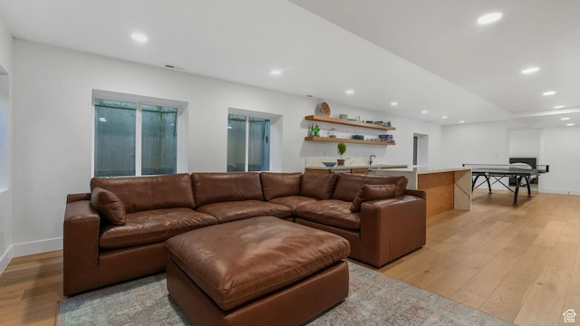 3343 E Stone Mountain Ln, Sandy, UT 84092 - living room featuring light wood-style floors, recessed lighting, bar with sink, and baseboards