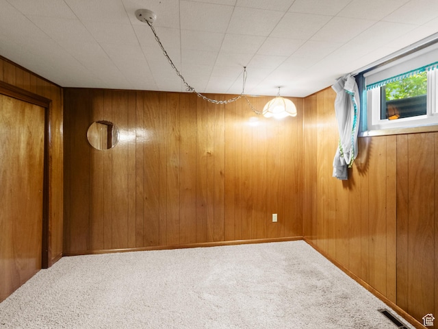 235 E 800 N Unit 2, Tremonton, UT 84337 - spare room featuring wood walls and carpet flooring