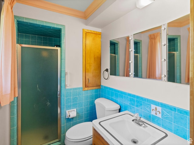 235 E 800 N Unit 2, Tremonton, UT 84337 - full bath with tile walls, a shower stall, toilet, vanity, and wainscoting