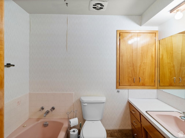 235 E 800 N Unit 2, Tremonton, UT 84337 - bathroom featuring vanity, a garden tub, toilet, and wallpapered walls