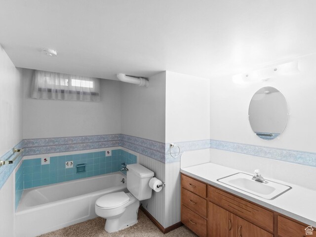 235 E 800 N Unit 2, Tremonton, UT 84337 - full bathroom featuring a garden tub, toilet, vanity, wainscoting, and tile walls