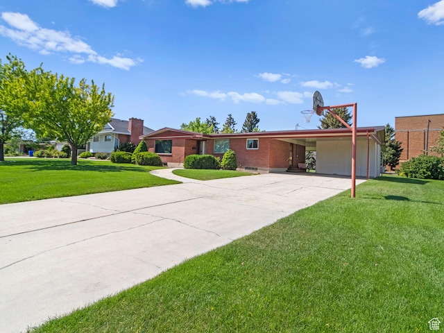 235 E 800 N Unit 2, Tremonton, UT 84337 - view of front of house with a carport, a front lawn, concrete driveway, and brick siding