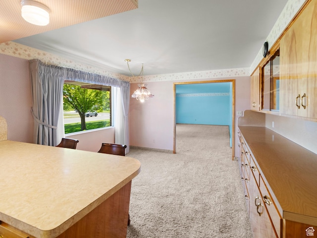 235 E 800 N Unit 2, Tremonton, UT 84337 - kitchen with light carpet, a chandelier, wallpapered walls, and pendant lighting