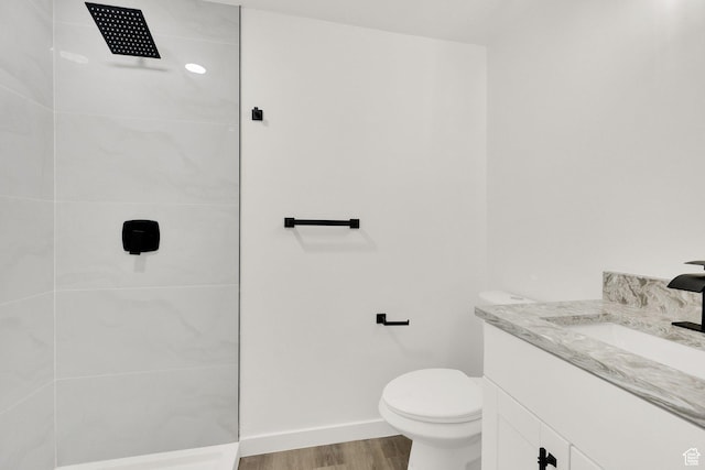 2054 W Mark St, Layton, UT 84041 - bathroom with a walk in shower, vanity, wood finished floors, toilet, and baseboards