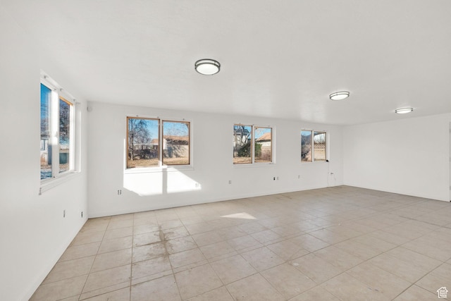 2054 W Mark St, Layton, UT 84041 - spare room featuring light tile patterned flooring and baseboards