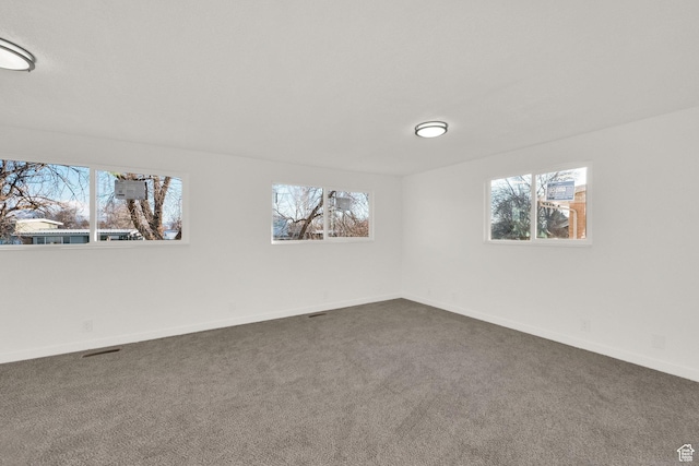 2054 W Mark St, Layton, UT 84041 - unfurnished room featuring healthy amount of natural light, dark carpet, and baseboards
