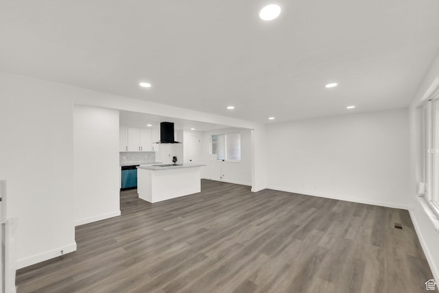 2054 W Mark St, Layton, UT 84041 - unfurnished living room with recessed lighting, dark wood-type flooring, and baseboards