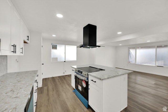 2054 W Mark St, Layton, UT 84041 - kitchen featuring exhaust hood, stainless steel appliances, wood finished floors, plenty of natural light, and recessed lighting