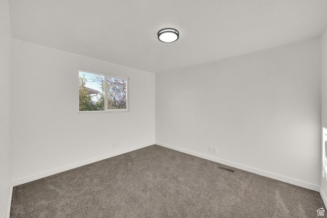2054 W Mark St, Layton, UT 84041 - empty room with dark colored carpet and baseboards