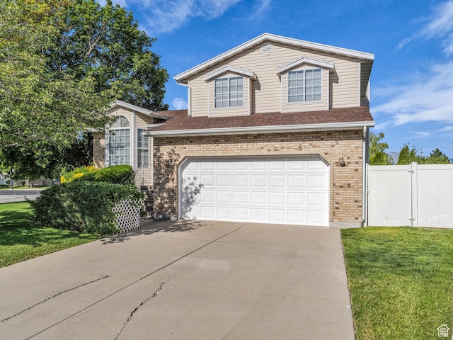4853 W Ticklegrass Rd, West Jordan, UT 84081 - traditional-style home featuring brick siding, concrete driveway, a garage, and roof with shingles