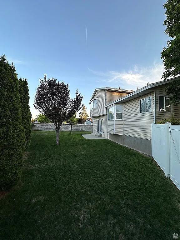 4853 W Ticklegrass Rd, West Jordan, UT 84081 - view of yard featuring a patio area