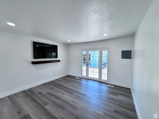 5135 W 4170 S, West Valley City, UT 84120 - unfurnished living room featuring electric panel, dark wood-style flooring, baseboards, recessed lighting, and a textured ceiling