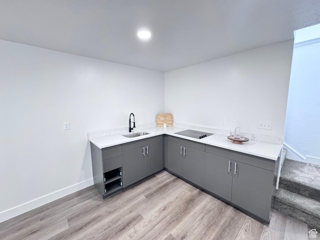 5135 W 4170 S, West Valley City, UT 84120 - kitchen with gray cabinets, a sink, light wood-type flooring, and light countertops