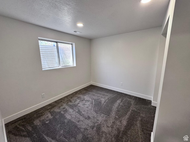 5135 W 4170 S, West Valley City, UT 84120 - spare room featuring dark carpet, a textured ceiling, and baseboards
