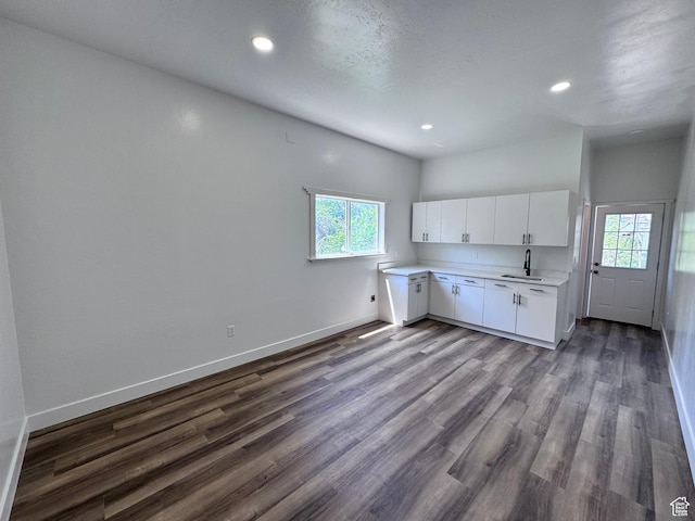 5135 W 4170 S, West Valley City, UT 84120 - kitchen featuring a sink, baseboards, light countertops, healthy amount of natural light, and recessed lighting