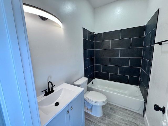 5135 W 4170 S, West Valley City, UT 84120 - bathroom with toilet, tub / shower combination, vanity, and wood finished floors