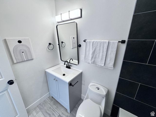 5135 W 4170 S, West Valley City, UT 84120 - bathroom featuring vanity, toilet, and baseboards